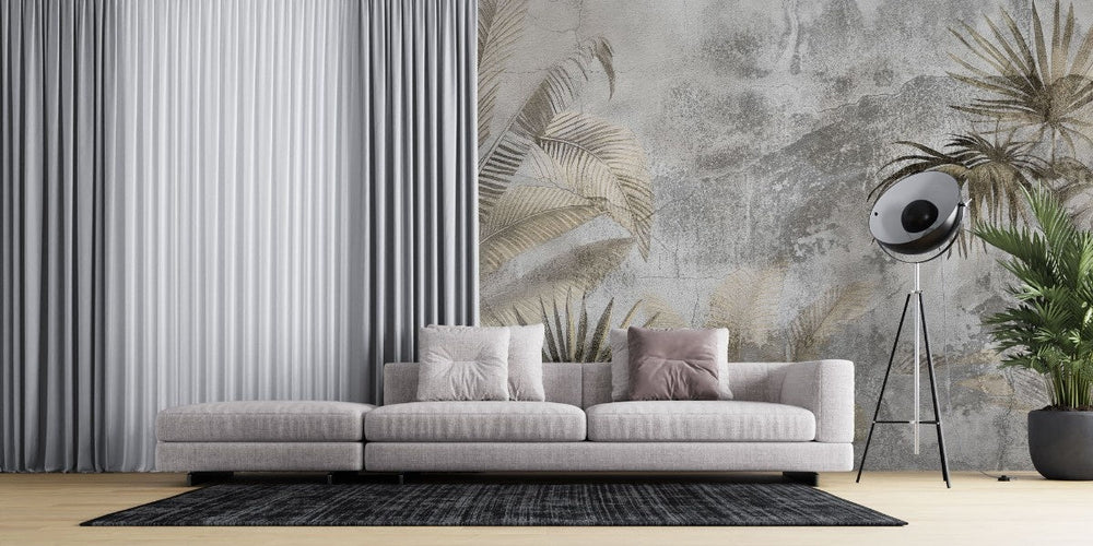 Tapet personalizat leaf cu frunze de palmier si alte plante exotice in tonuri de bej si gri pe un fundal cu aspect de stucada pentru un stil rustic modern gold concrete leaves