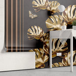 Tapet personalizat fine art cu frunze aurii de monstera pe un fundal negru brass monstera