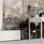 Tapet personalizat leaf cu frunze de monstera albastre vazute printr un cadru metalic pe un fundal caramiziu grunge monstera
